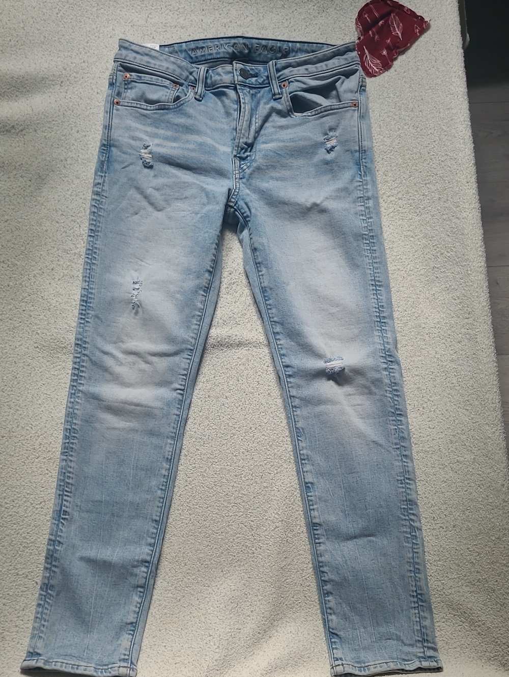 American Eagle Outfitters Light Blue Skinny Jeans with Distressed Knees
